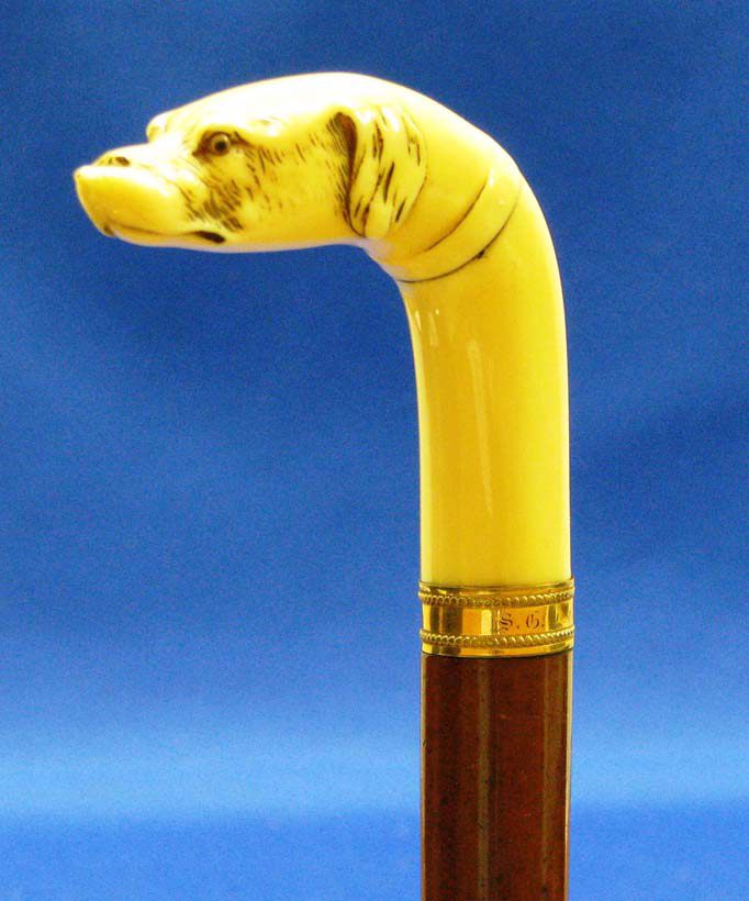brown%20and%20gold%20ivory%20cane%20with%20a%20dog%20head%20handle